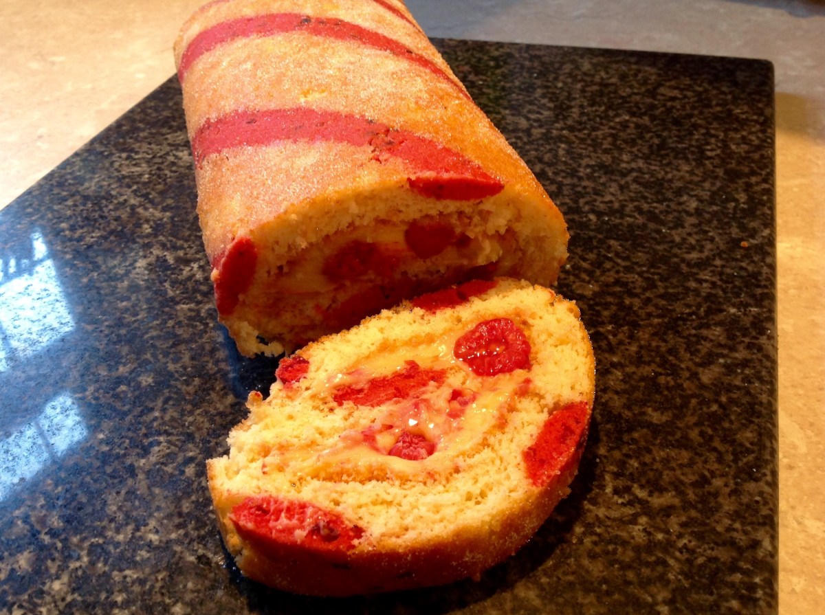 Passion fruit & raspberry swiss roll with passion fruit&nbsp;ganache
