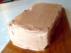 Spread with buttercream & ready to glaze