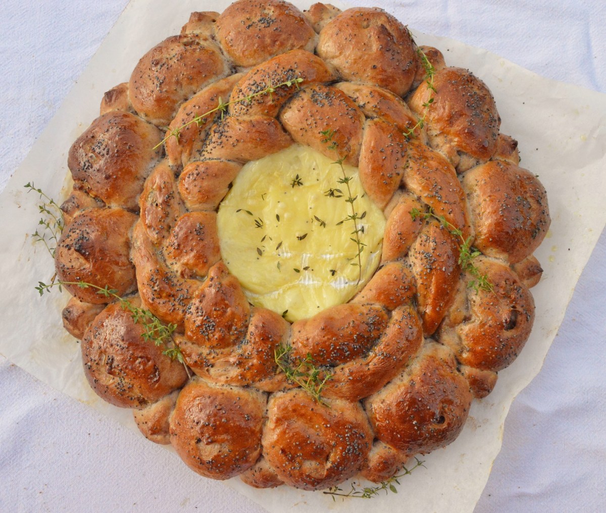 Walnut & raisin “tear and share” bread centrepiece with melted&nbsp;Brie